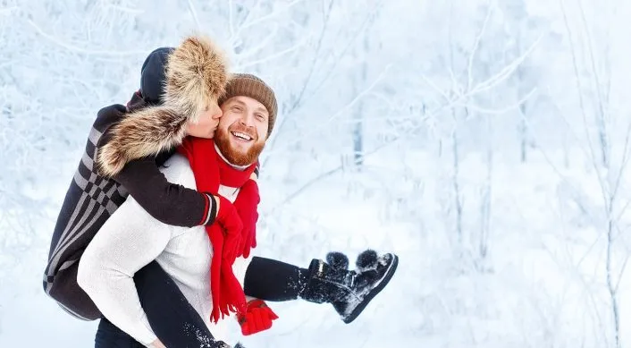 a happy couple in the snow