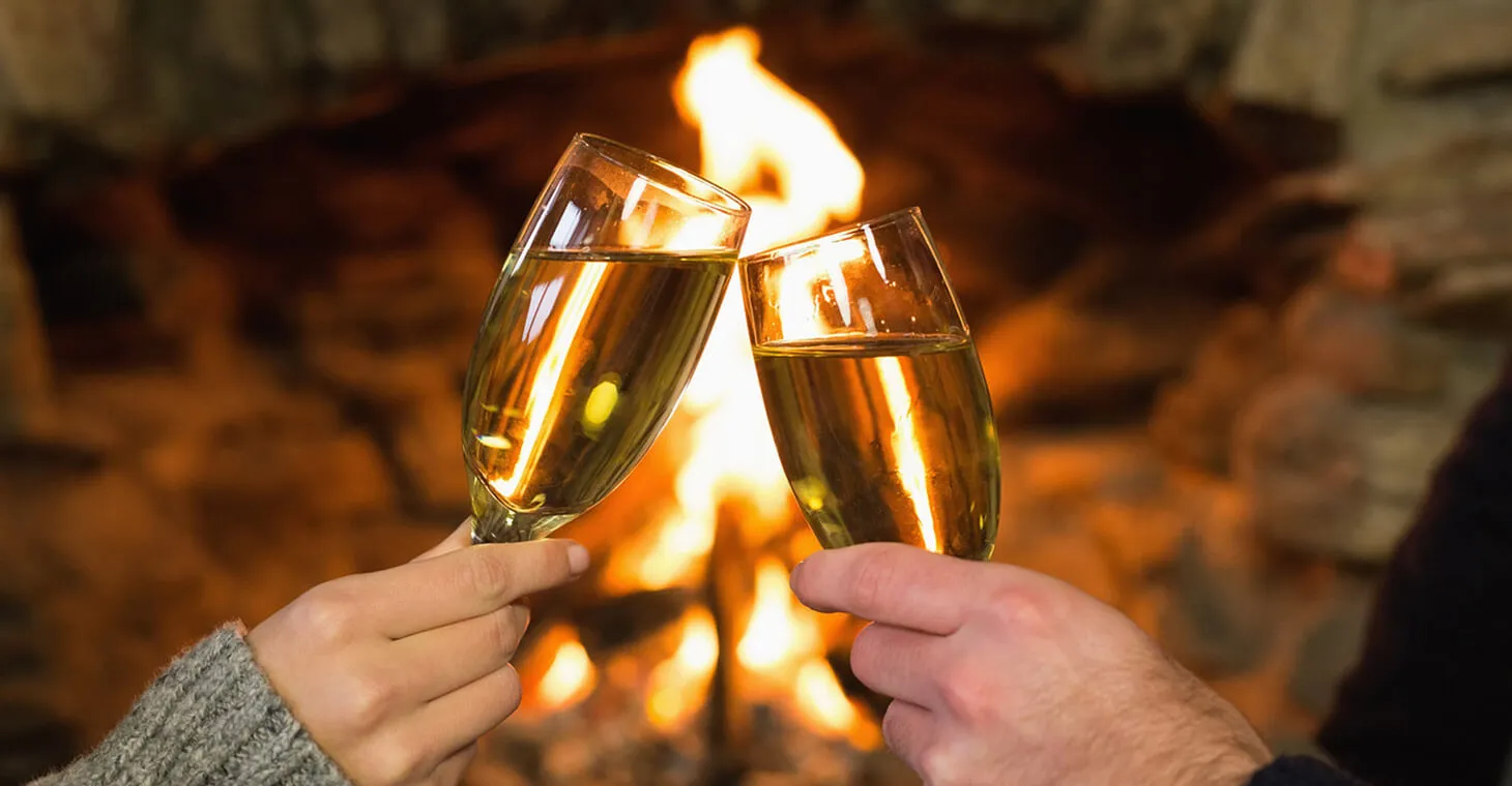 a couple toasting with wine at Washington House Inn