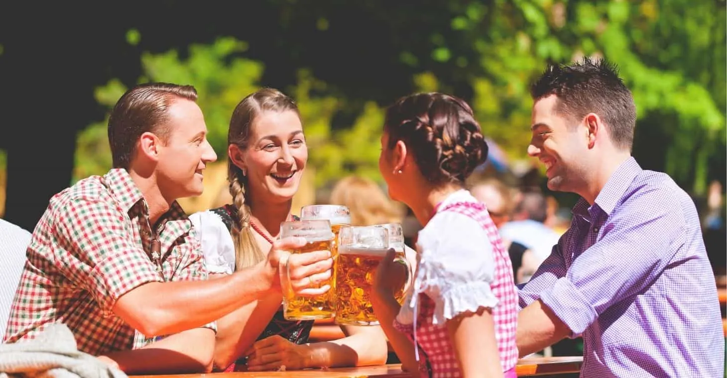 Friends enjoying festival, beer, and traditional German music near Milwaukee, Wisconsin
