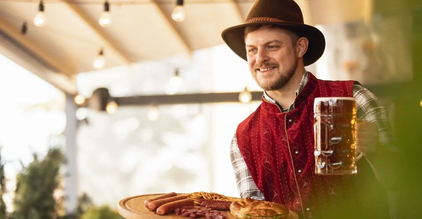 Man in traditional Bavarian outfit celebrating Pommerntag