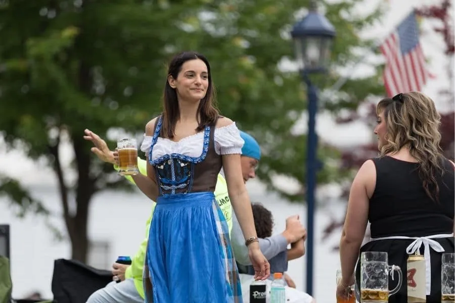 Woman in traditional Bavarian outfit enjoying Oktoberfest near Chicago, Wisconsin.