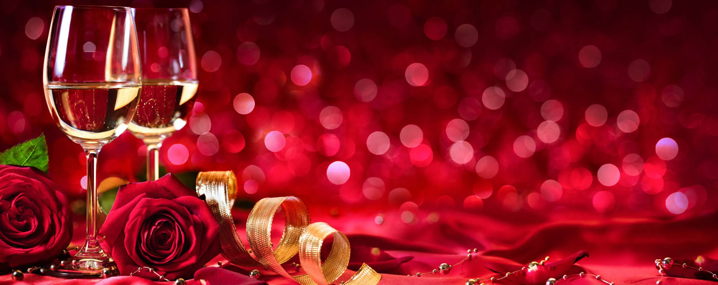 Wine and roses on a red background