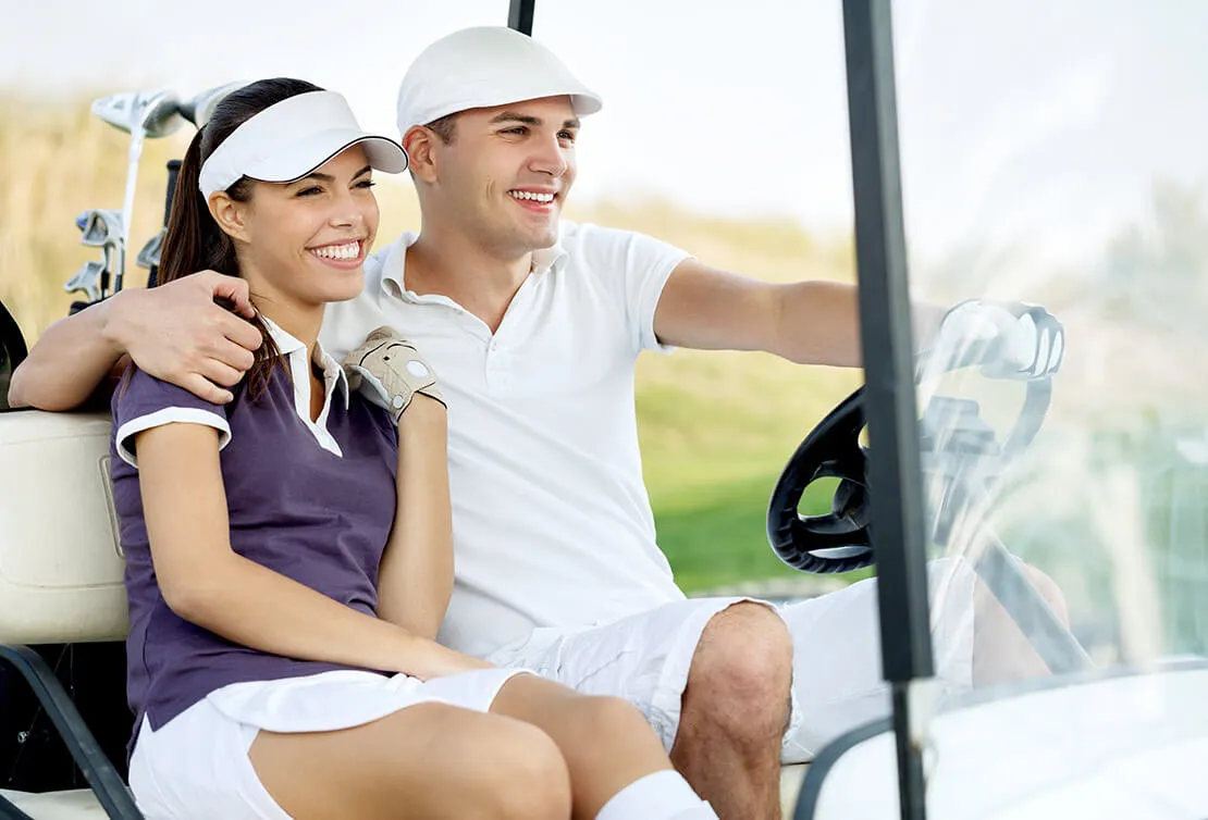 Couple in a golf cart