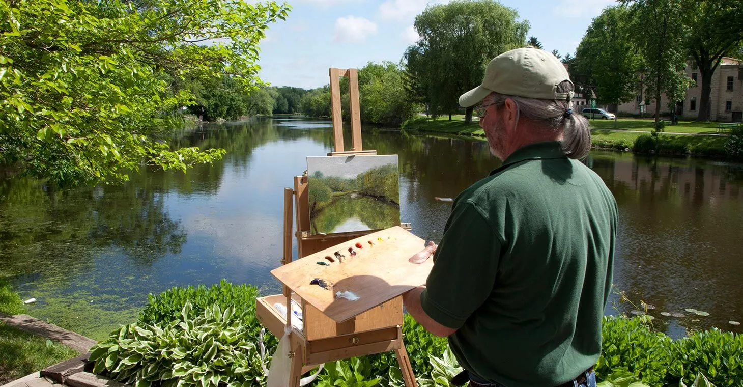 Painter painting the creek