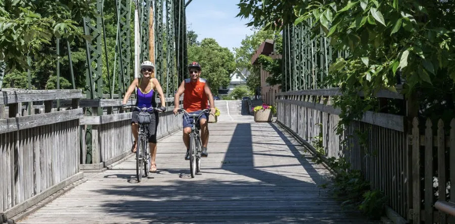Couple biking on the Ozaukee Interurban Trail in Wisconsin