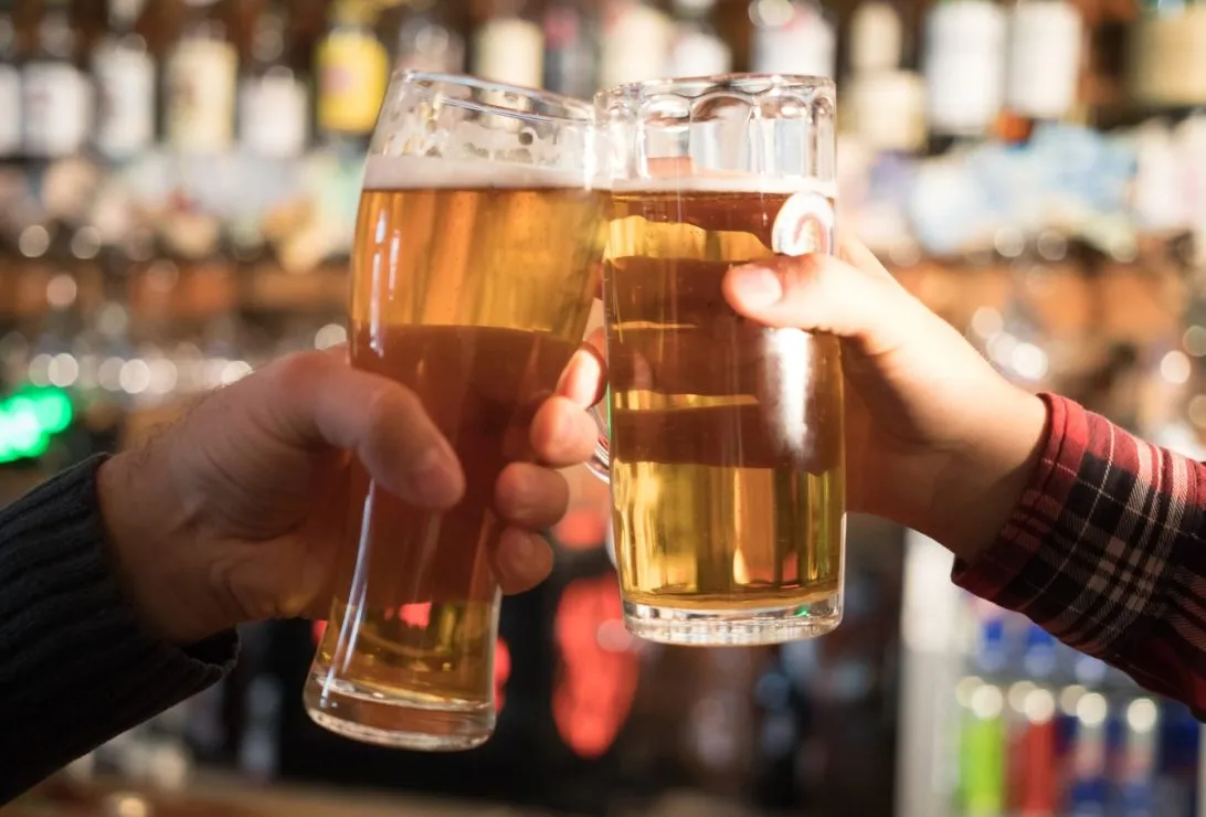 Up close shot of cheers with beers