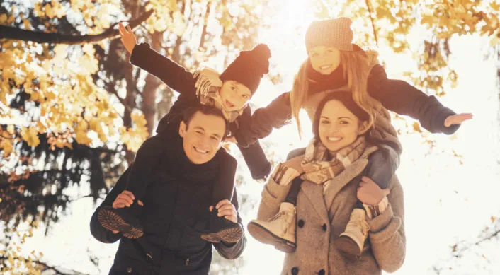 a young family having fun in the park