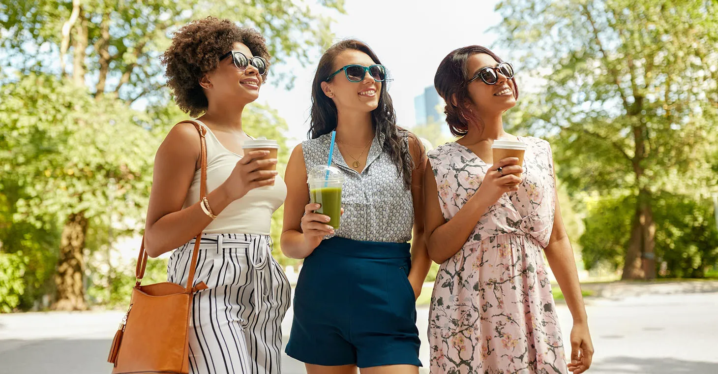 Three girls drinking coffee and smoothies outside in Cedarburg