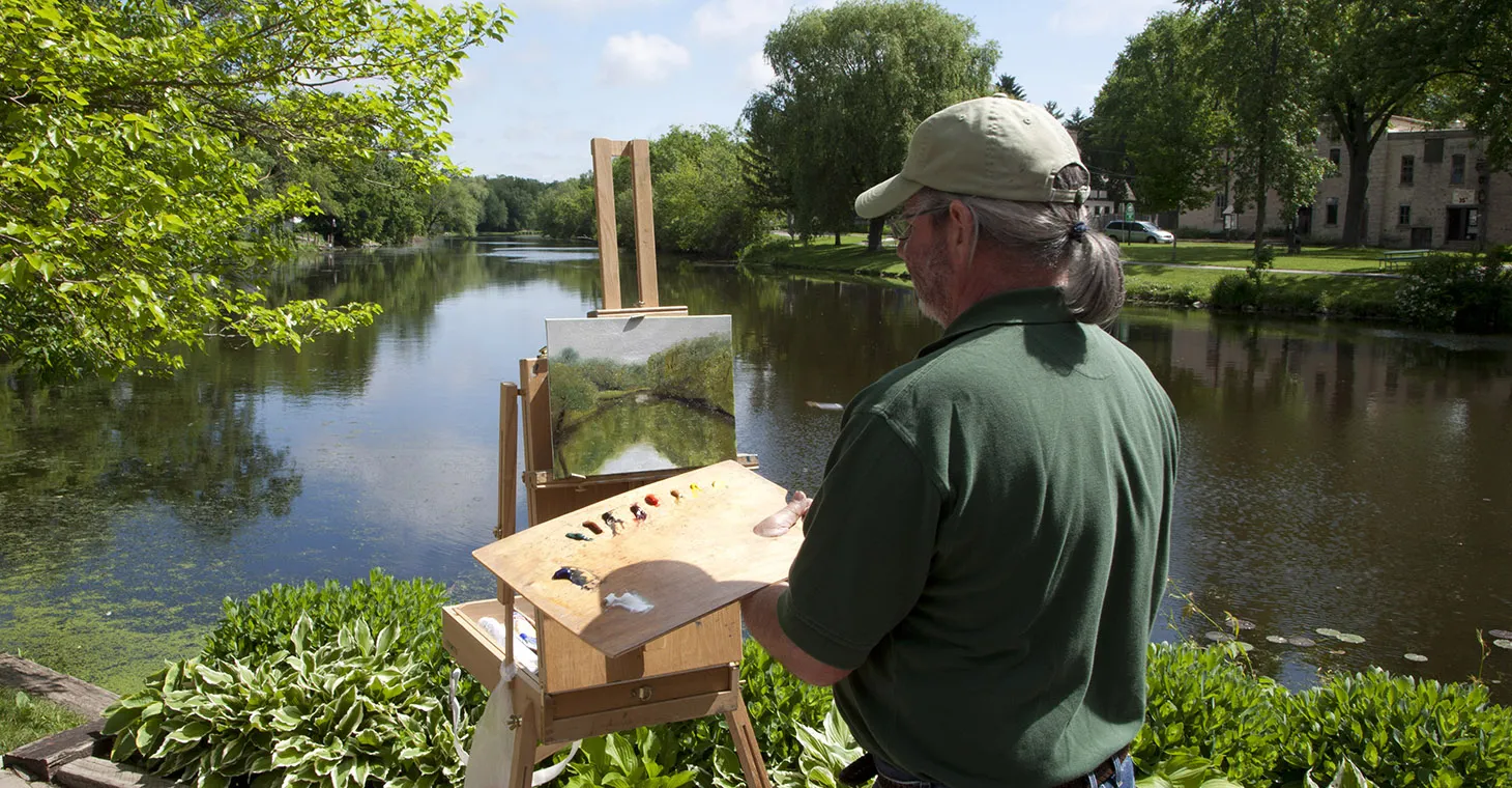 Artist painting outside in Cedarburg, WI