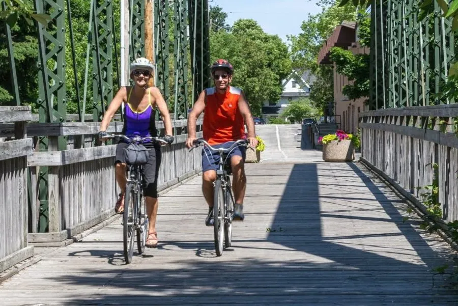 a couple riding bikes outdoors in Cedarburg