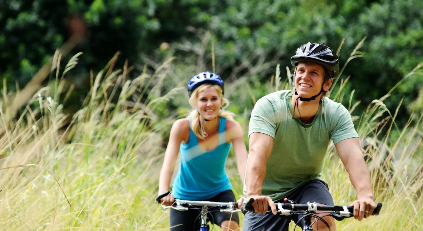 couple riding bikes outdoors in Cedarburg