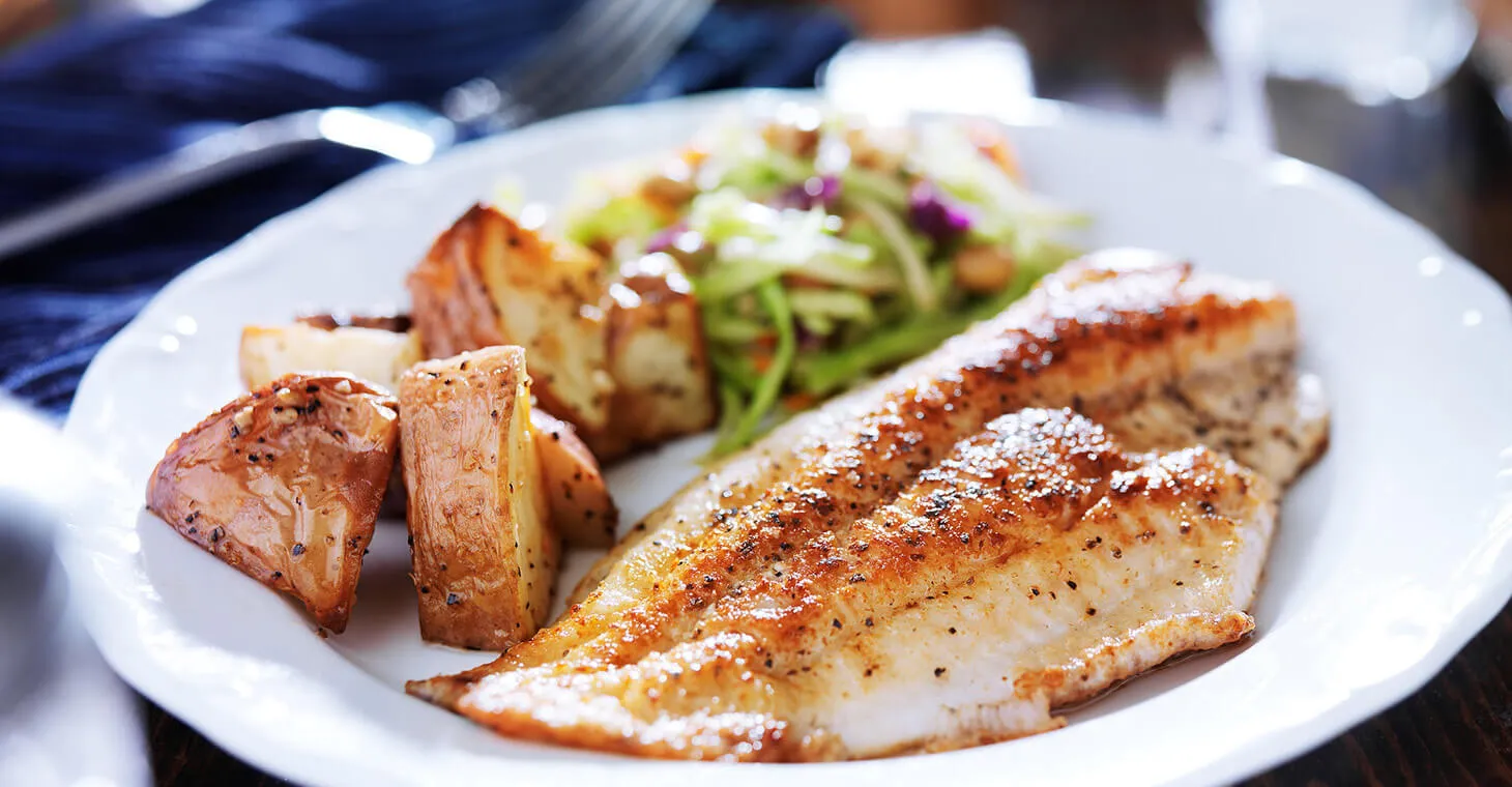 a plate of fish and potatoes in Cedarburg