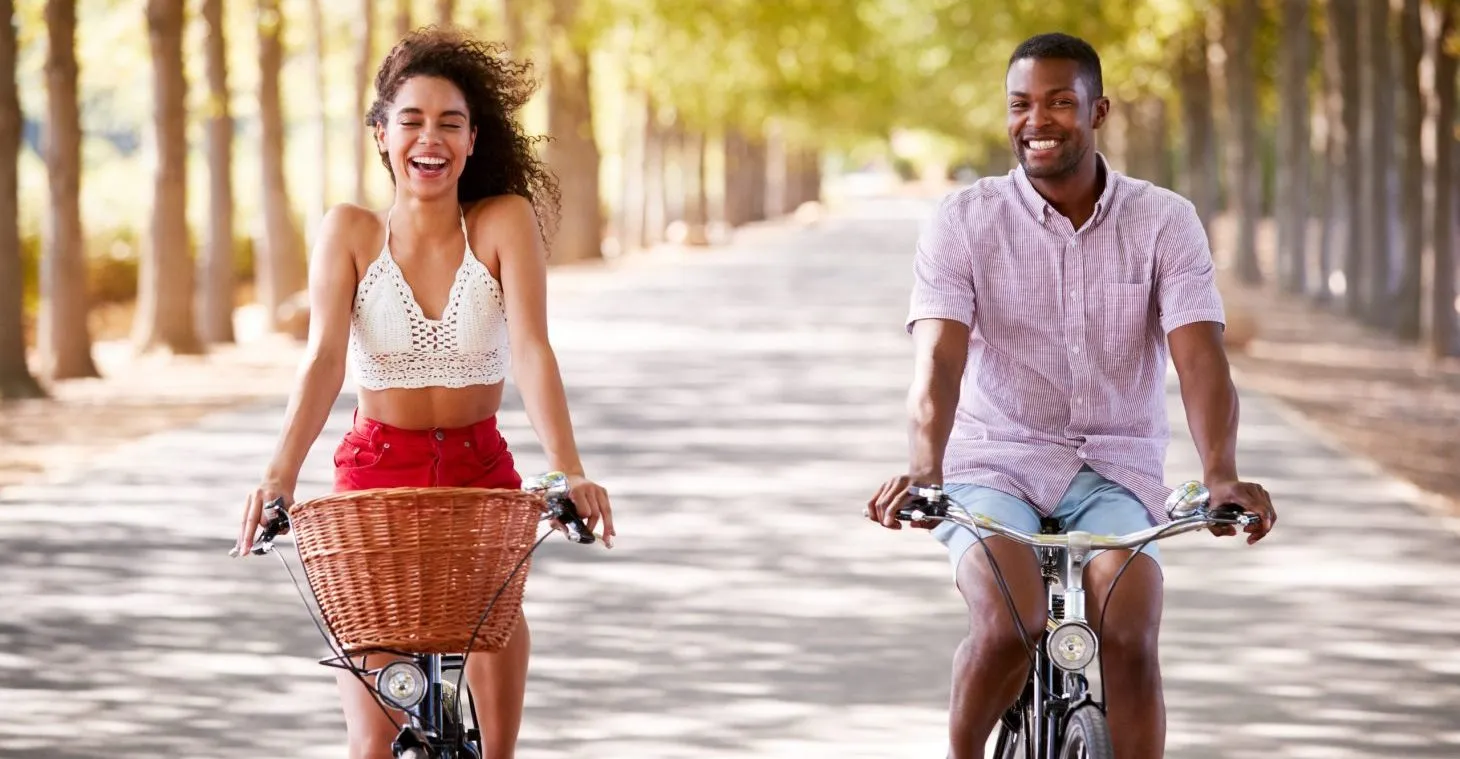 a couple riding bikes on a summer vacation in wisconsin