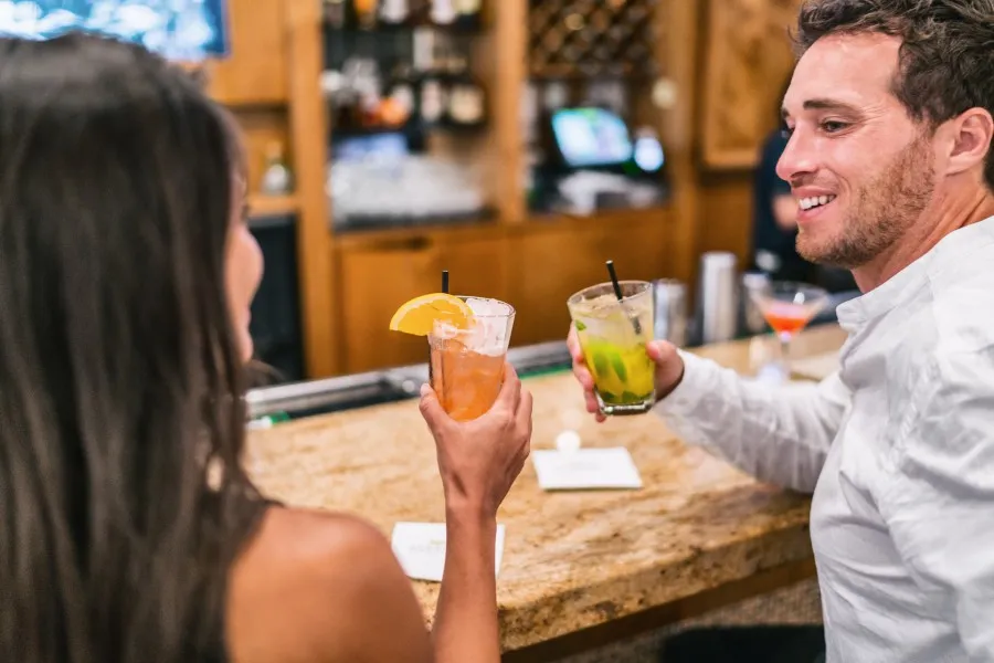 couple with cocktails in restaurant