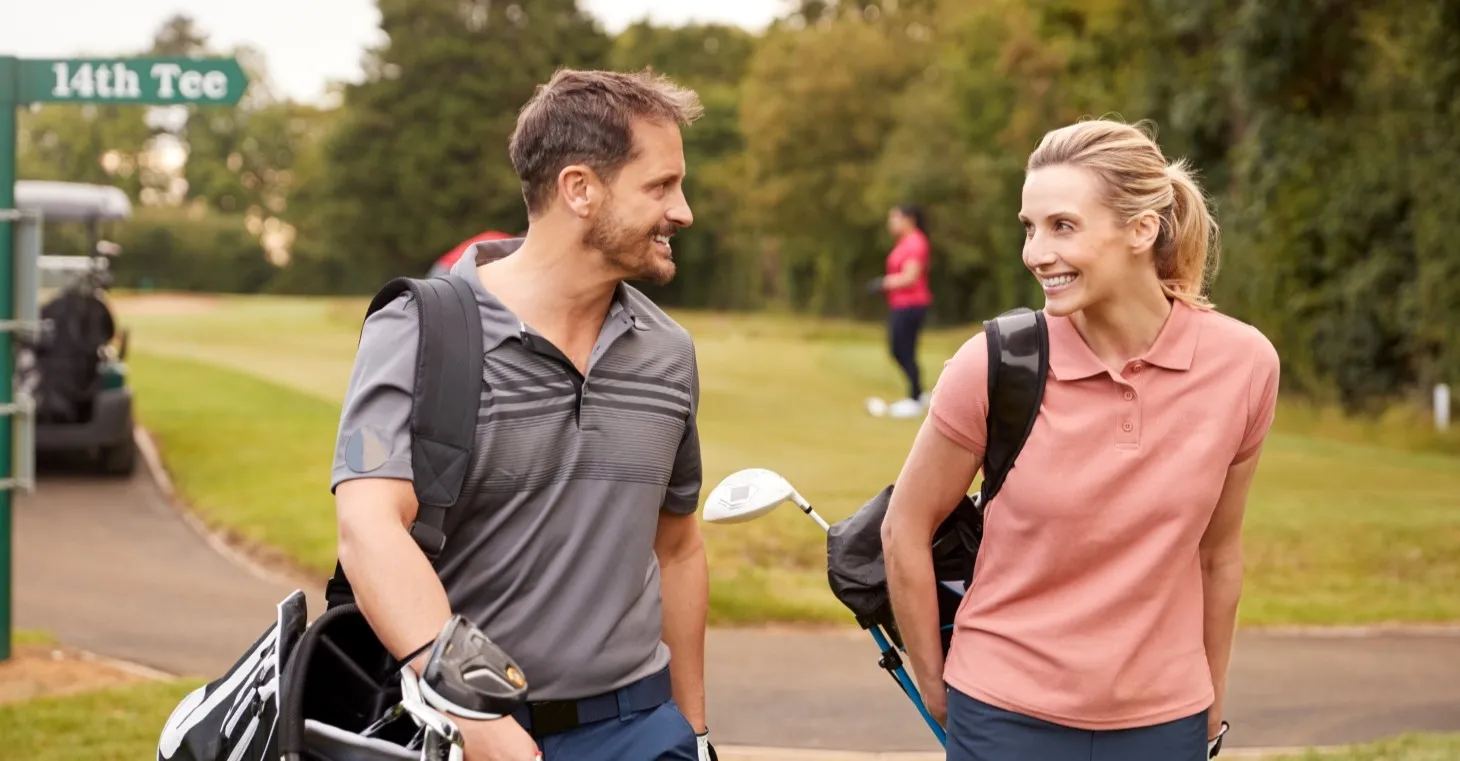 a couple playing golf together on a romantic getaway near Chicago