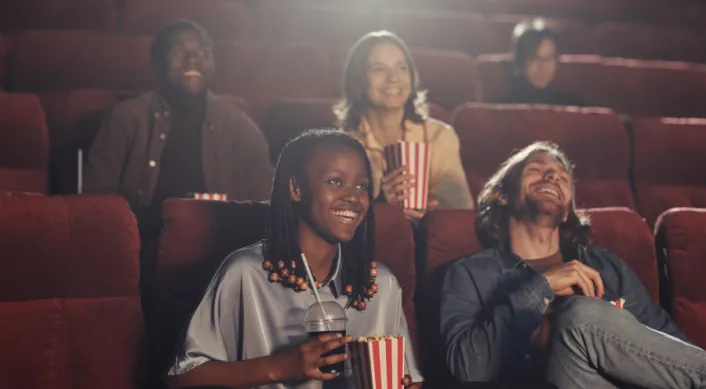 a group of people at Rivoli Theatre watching a film