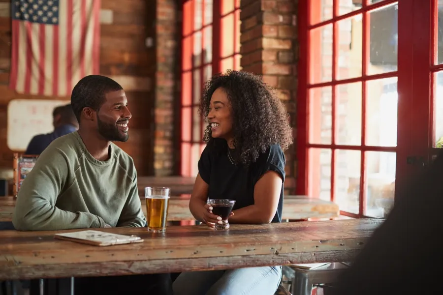 a young couple drinking beer at a Cedarburg, WI brewery