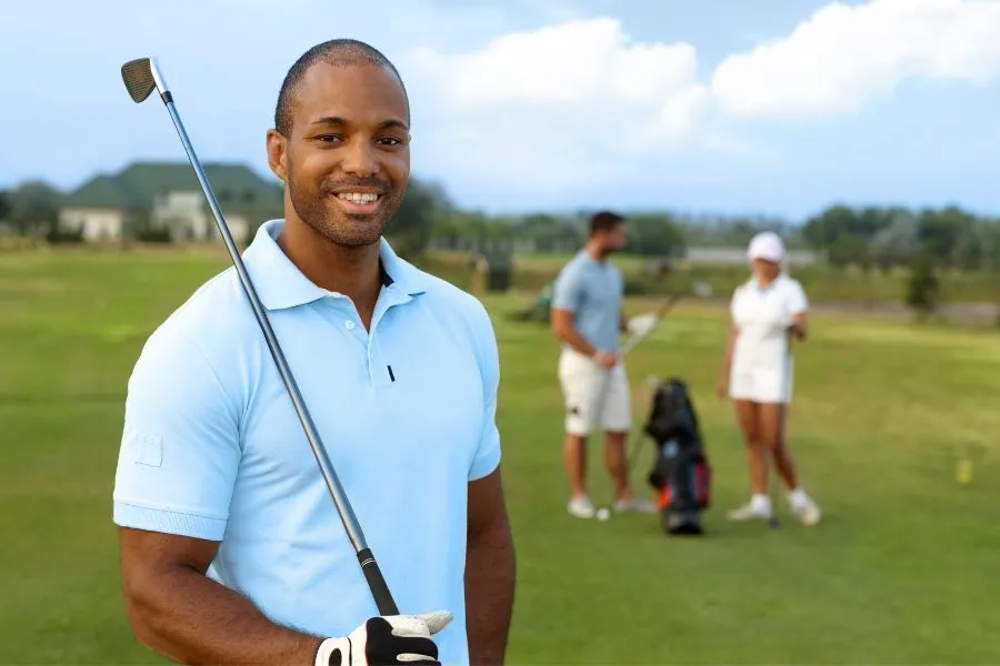 man on golf course with club