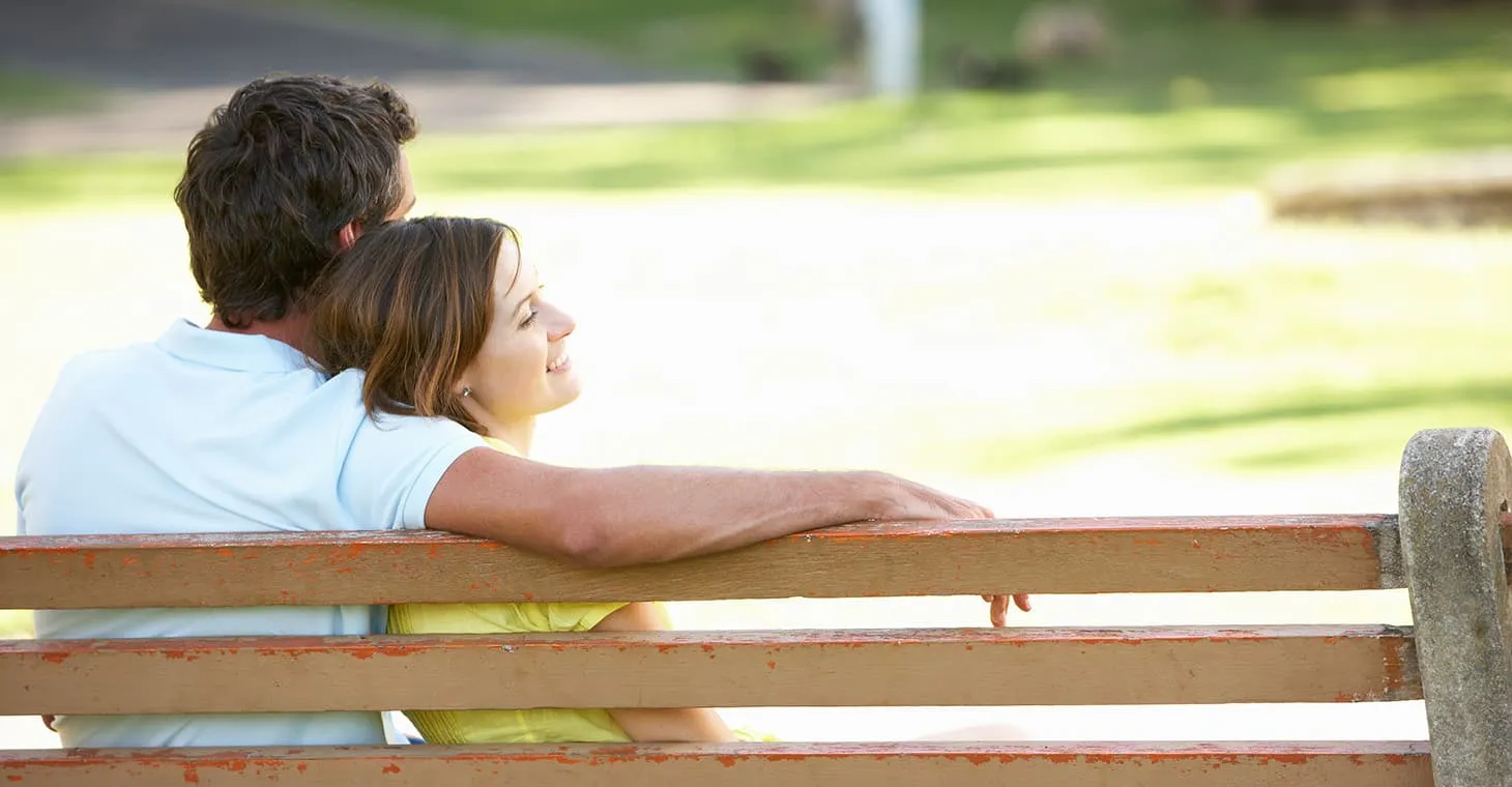 romantic couple enjoying drinks together at an outdoor bar