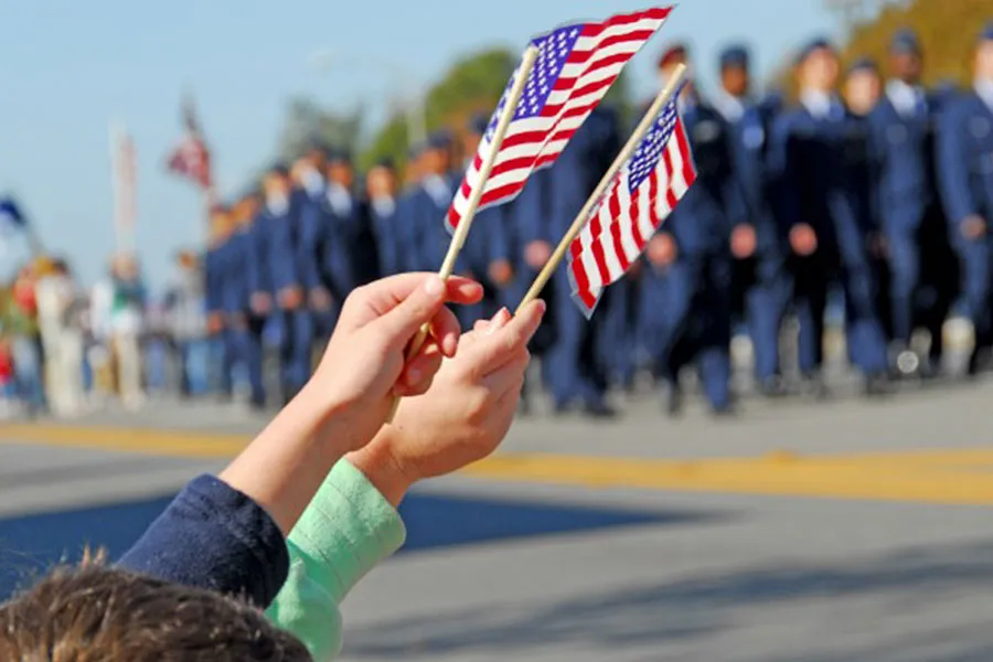 Kids waving American flags at the Cedarburg WI 4th of July Parade