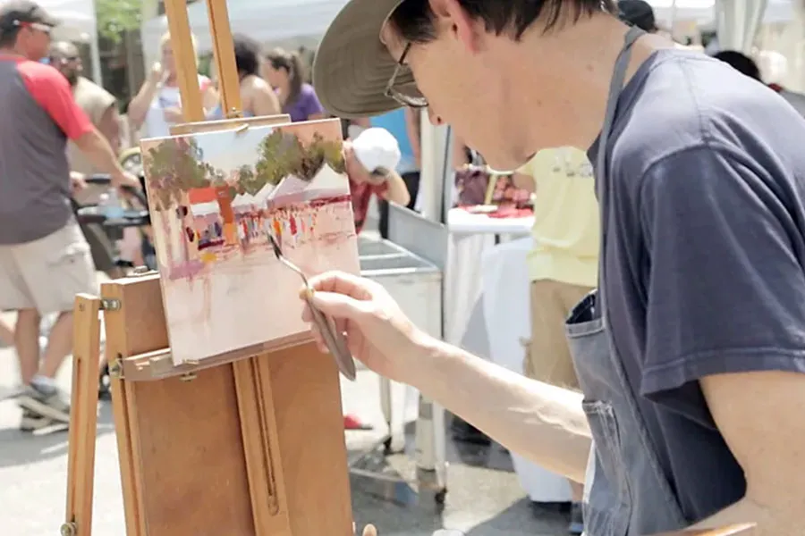Man painting outside at the Cedarburg, WI Plein Arts Festival
